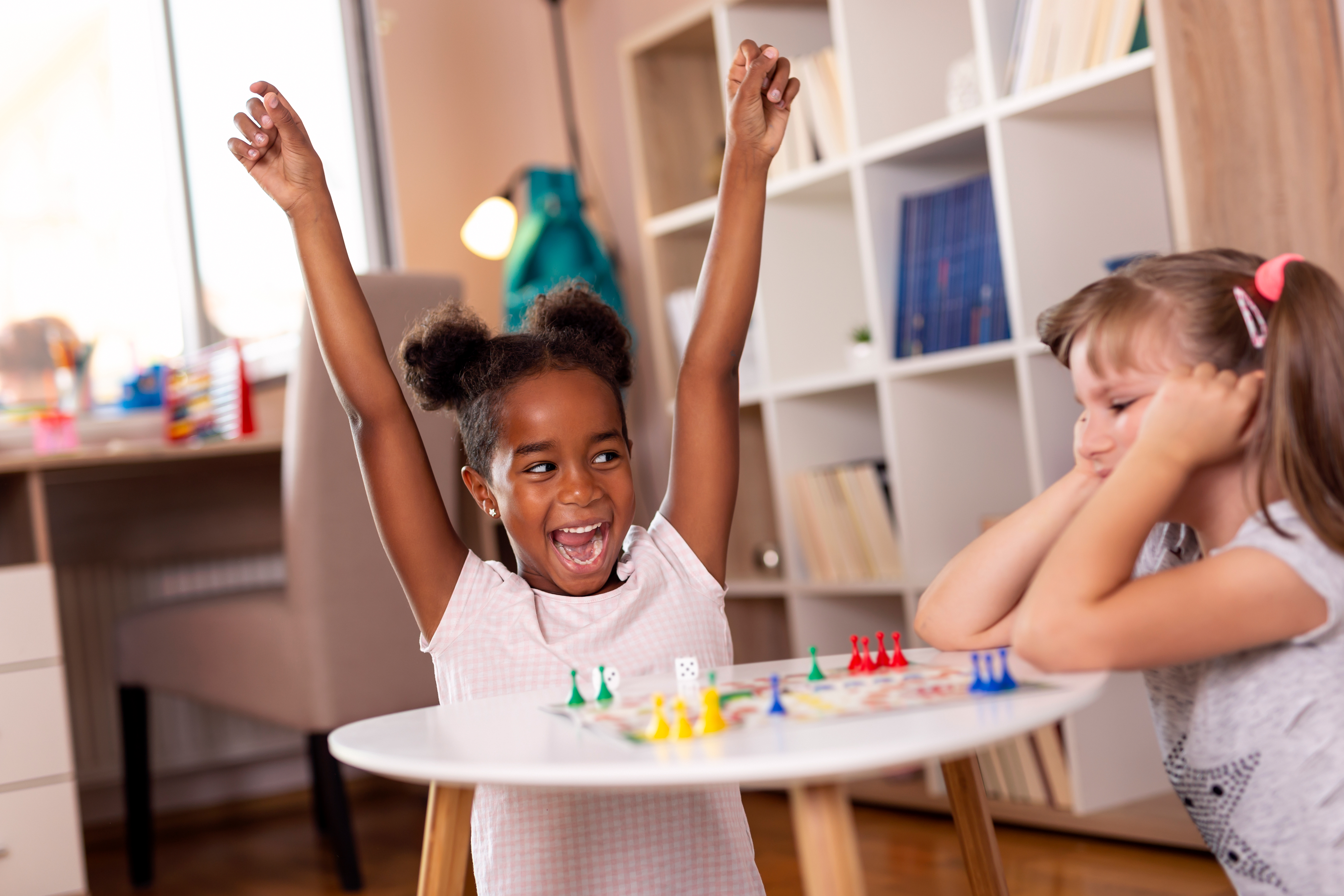 little girls playing board game