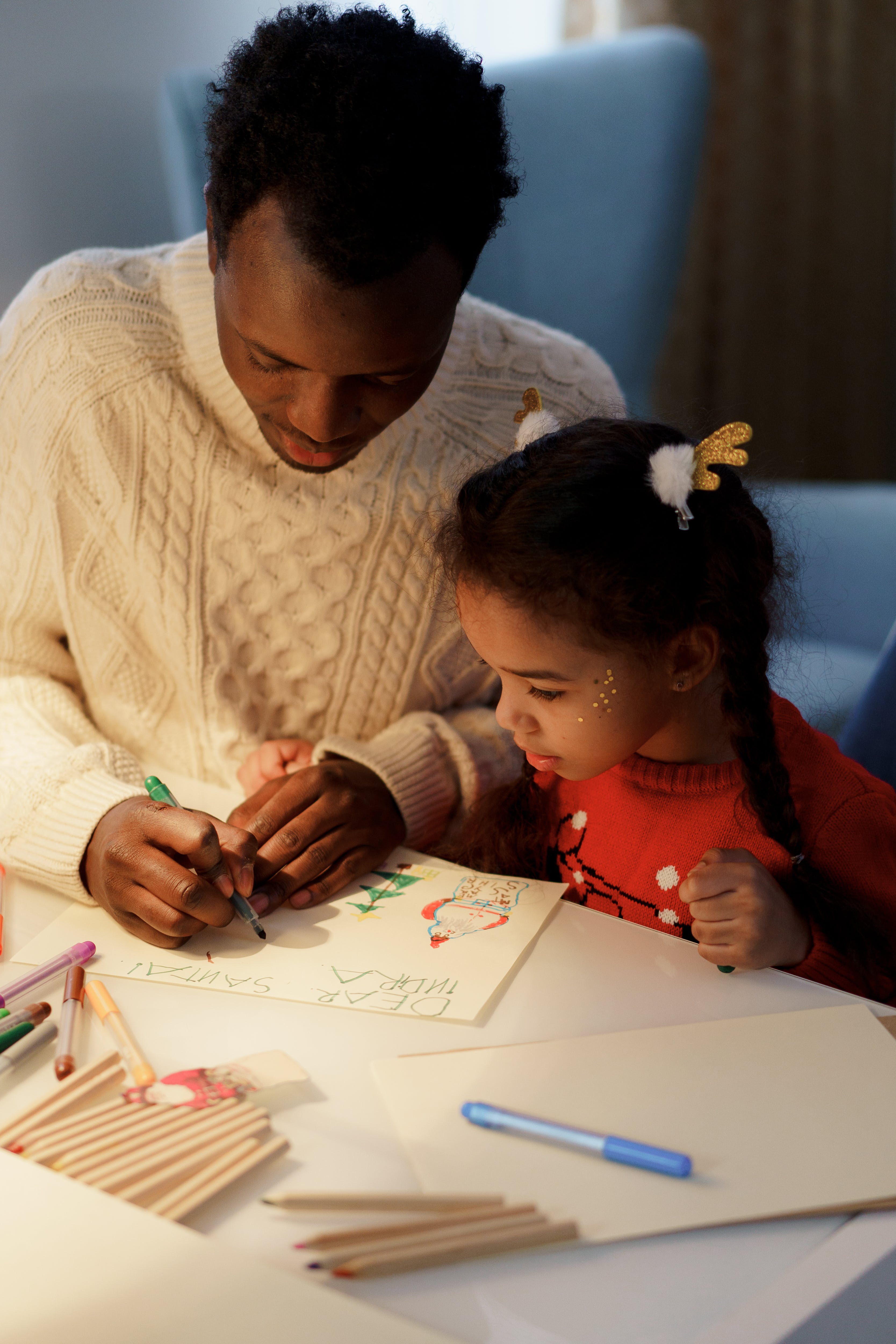 A father and daughter drawing.